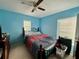 Comfortable bedroom with natural light, and neutral-toned carpet at 32111 Brookstone Dr, Wesley Chapel, FL 33545