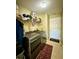 Laundry room with front-loading washer and dryer and wire shelving at 32111 Brookstone Dr, Wesley Chapel, FL 33545