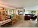 Inviting living room next to a dining room featuring an open layout and neutral tones at 32111 Brookstone Dr, Wesley Chapel, FL 33545