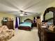 Spacious main bedroom features a ceiling fan, matching dressers, and plush carpeting at 32111 Brookstone Dr, Wesley Chapel, FL 33545