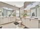 Bright bathroom features double sinks, soaking tub, modern fixtures, and stylish design at 32324 Rosewood Meadow Ln, Wesley Chapel, FL 33543