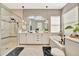 Modern bathroom features soaking tub, glass shower, double sinks, and contemporary finishes at 32324 Rosewood Meadow Ln, Wesley Chapel, FL 33543