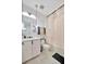 Modern bathroom features a sleek vanity, pendant lighting, and shower with tub combination at 32324 Rosewood Meadow Ln, Wesley Chapel, FL 33543