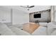 Living room features hardwood floors, comfortable seating, modern fan, and wall art and is perfect for entertaining at 32324 Rosewood Meadow Ln, Wesley Chapel, FL 33543