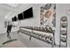 Well-equipped fitness center with modern weight machines and fitness accessories for convenient at-home workouts at 32324 Rosewood Meadow Ln, Wesley Chapel, FL 33543