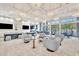 Bright community lounge with ample seating, modern decor, and large windows offering outdoor views at 32324 Rosewood Meadow Ln, Wesley Chapel, FL 33543
