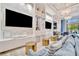 A modern community lounge area with comfortable seating and entertainment features for residents at 32324 Rosewood Meadow Ln, Wesley Chapel, FL 33543