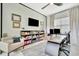 Bright office with a ceiling fan, an area rug, a desk and lots of natural light at 32324 Rosewood Meadow Ln, Wesley Chapel, FL 33543