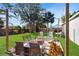 Inviting backyard with a fire pit surrounded by seating and lush landscaping at 3238 6Th W Ave, Palmetto, FL 34221