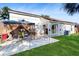 Backyard featuring a gazebo, a stone paver patio and green grass at 3238 6Th W Ave, Palmetto, FL 34221