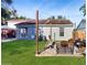 Cozy backyard with a fire pit, comfortable seating, and string lights for ambiance at 3238 6Th W Ave, Palmetto, FL 34221