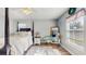 Bedroom featuring wood floors, a four-poster bed, ceiling fan, and decorative accents at 3238 6Th W Ave, Palmetto, FL 34221