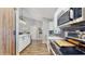 Bright kitchen featuring white cabinets, marble countertops and modern, stainless steel appliances at 3238 6Th W Ave, Palmetto, FL 34221