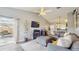 Cozy living room with a fireplace, views to the kitchen and outdoor patio area at 3238 6Th W Ave, Palmetto, FL 34221