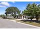 Charming single-story home with a well-maintained lawn, mature trees, and inviting curb appeal at 3601 76Th N St, St Petersburg, FL 33710