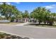 Charming single-story home featuring a well-maintained lawn, mature trees, and a long driveway at 3601 76Th N St, St Petersburg, FL 33710