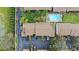 Aerial view of condo building showcasing pool, parking, landscaping, and proximity to recreational areas at 3706 Greenery Ct # 206, Tampa, FL 33618