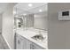 The bathroom features a mirrored wall above the marble countertop vanity at 3706 Greenery Ct # 206, Tampa, FL 33618