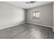 Bedroom with ceiling fan, neutral paint, new floors and a good-sized window at 3706 Greenery Ct # 206, Tampa, FL 33618