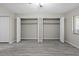 This is a bright bedroom, closet with double doors and stylish wood-look gray flooring at 3706 Greenery Ct # 206, Tampa, FL 33618