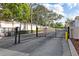Gated entrance to the community with secure access and well-maintained landscaping at 3706 Greenery Ct # 206, Tampa, FL 33618