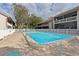 Community pool with lounge seating and view of residential buildings at 3706 Greenery Ct # 206, Tampa, FL 33618