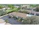Exterior aerial of condos featuring parking, landscaping, and pool access for residents and guests at 3706 Greenery Ct # 206, Tampa, FL 33618