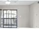 A bright living room with sliding glass doors that lead out to a patio at 3706 Greenery Ct # 206, Tampa, FL 33618
