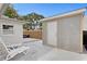 Backyard view featuring a patio with lounge chairs and a storage shed with a white door at 4003 W Lemon St, Tampa, FL 33609