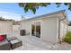 A backyard featuring a patio with outdoor seating, a privacy fence and gray exterior at 4003 W Lemon St, Tampa, FL 33609