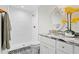 Tastefully updated bathroom with decorative tile flooring, granite counter tops and a glass enclosed shower at 4003 W Lemon St, Tampa, FL 33609