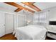 Primary bedroom featuring wood beam ceilings and two closets at 4003 W Lemon St, Tampa, FL 33609