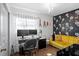 Bright office space with modern desk, monitors, stylish accent wall, and a comfortable yellow velvet sofa at 4003 W Lemon St, Tampa, FL 33609