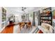 Charming dining room with unique decor, natural light, ceiling fan, and attractive wood floors at 4563 25Th S Ave, St Petersburg, FL 33711