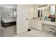 Bathroom with a white vanity, ample counter space, and view of the bedroom at 4612 Netherwood Dr, Tampa, FL 33624