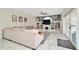 Bright living room with a large sectional sofa and built-in bookshelves at 4612 Netherwood Dr, Tampa, FL 33624