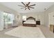 Comfortable main bedroom with a decorative bed frame, soft carpet, and natural light at 4612 Netherwood Dr, Tampa, FL 33624