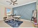 This office includes a geometric accent wall, large window, ceiling fan, and exercise equipment at 4612 Netherwood Dr, Tampa, FL 33624