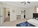 Bright office with a modern desk, ceiling fan, and door leading to hallway at 4612 Netherwood Dr, Tampa, FL 33624