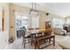This kitchen dining area boasts lots of natural light and adjacent access to the sunroom and living room at 5119 Whispering Leaf Trail, Valrico, FL 33596