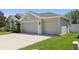 Spacious three-car garage with ample parking and convenient access at 5119 Whispering Leaf Trail, Valrico, FL 33596