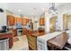 A gourmet kitchen boasts stainless steel appliances, granite countertops, and a cozy dining area for casual meals at 5119 Whispering Leaf Trail, Valrico, FL 33596