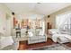 Inviting living room with hardwood floors, an open layout, and lots of natural light at 5119 Whispering Leaf Trail, Valrico, FL 33596