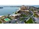Aerial view showcasing waterfront condo community, pool, landscaping, parking, and nearby access at 5200 Brittany S Dr # 204, St Petersburg, FL 33715