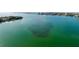 An aerial view of shimmering bay waters revealing intriguing seabed patterns, adding depth and mystery at 5200 Brittany S Dr # 204, St Petersburg, FL 33715