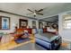 Spacious suite with a ceiling fan, dresser, and access to a well lit bedroom with a queen sized bed at 5200 Brittany S Dr # 204, St Petersburg, FL 33715