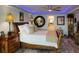 Spacious bedroom featuring a queen-size bed, elegant lighting, and stylish decor at 5200 Brittany S Dr # 204, St Petersburg, FL 33715