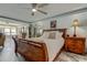 Spacious bedroom featuring a queen-size bed, elegant lighting, and stylish decor at 5200 Brittany S Dr # 204, St Petersburg, FL 33715