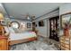 Bedroom featuring a statement floor, queen size bed, dresser, and flat screen television at 5200 Brittany S Dr # 204, St Petersburg, FL 33715