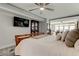 Well-lit bedroom featuring a queen sized bed, built in shelving and television for entertainment at 5200 Brittany S Dr # 204, St Petersburg, FL 33715